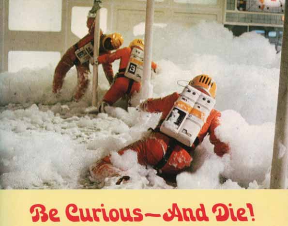 Caption: Be Curious and Die, Picture: Space Suited Figures Slipping in a Foamy Main Mission