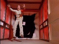 a stuntman falls through the vertical corridor set