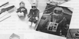 Figures dressed in space suits