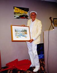 Martin Landau receives a painting from Bob Wood