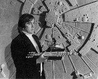 Brian Johnson in front of the Moonbase model
